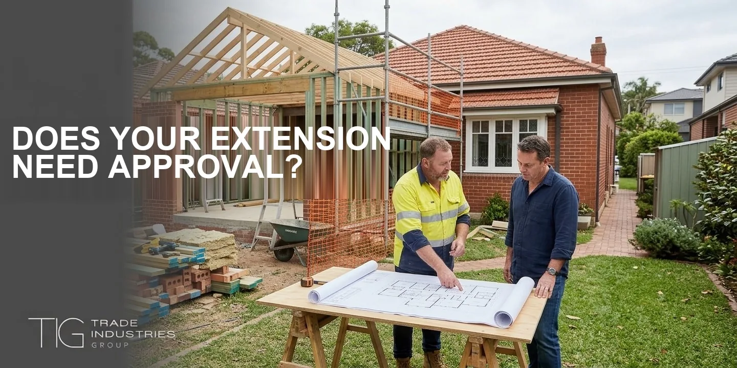 Home Extension Approval Sydney: DA, CDC or Exempt, and What Each One Means 9 Home extension approval Sydney: two men reviewing house plans in front of a timber-framed extension under construction